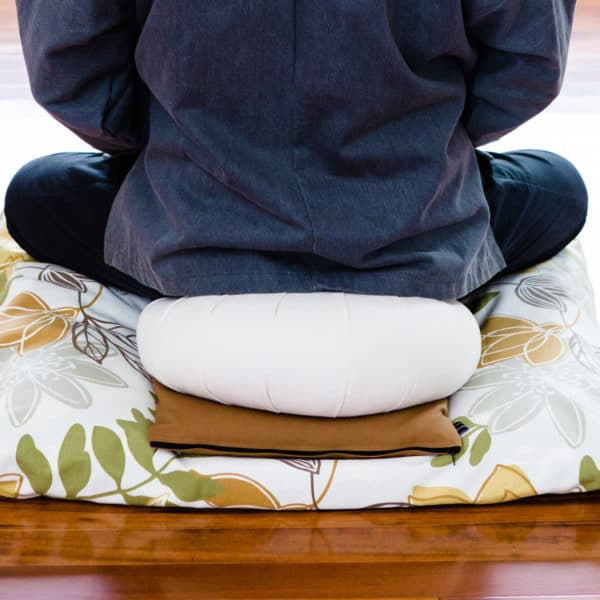 Seated position on zabuton with zafu and support cushion, floral cushion, samue jacket