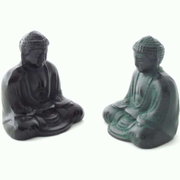 Two Iron Buddhas facing eachother