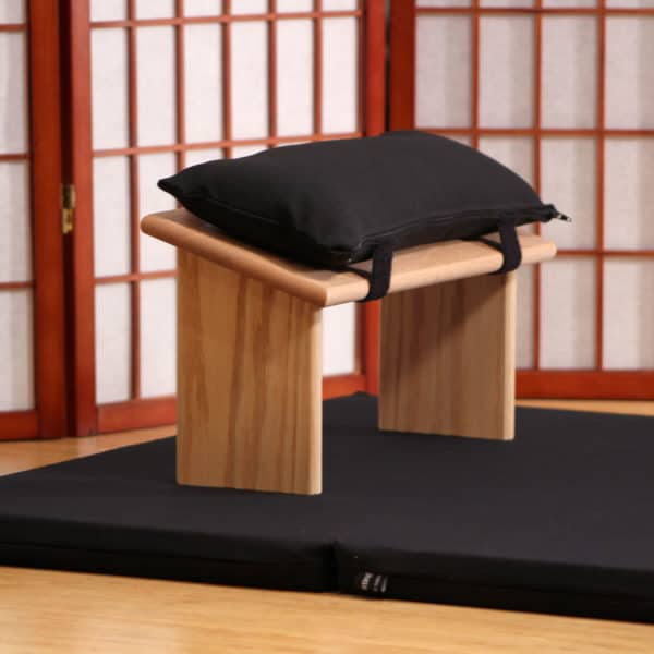 Black Bench cushion on traditional wooden meditation bench
