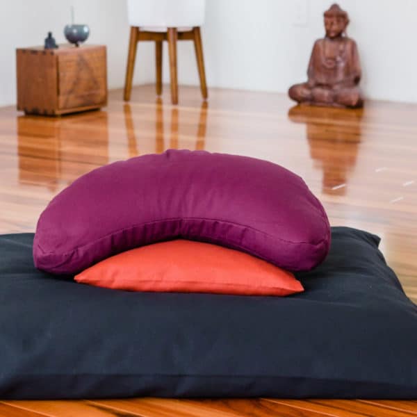 Crescent Zafu and zabuton meditation cushion set in calm meditation space