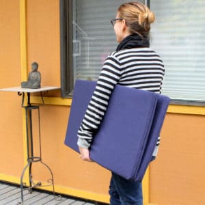 Carrying folding blue zabuton meditation cushion, foam meditation mat
