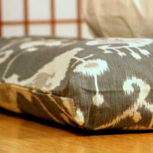 Thick zabuton meditation cushion in grey ikat, close up corner view