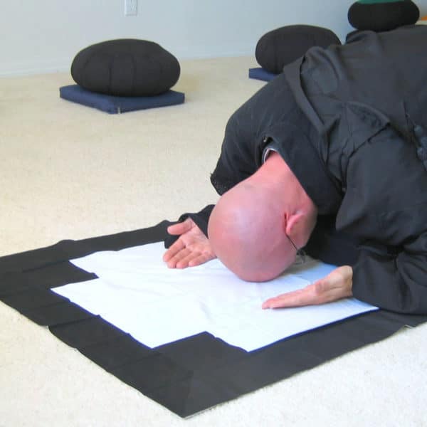 Man bowing on zagu Zen bowing cloth