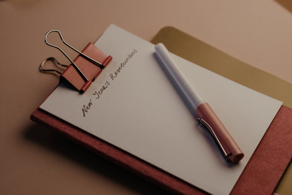 A note pad and pen for New Year resolutions.