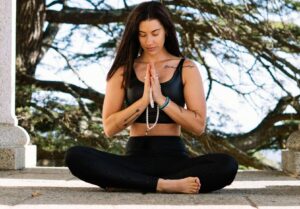 Woman meditating outside